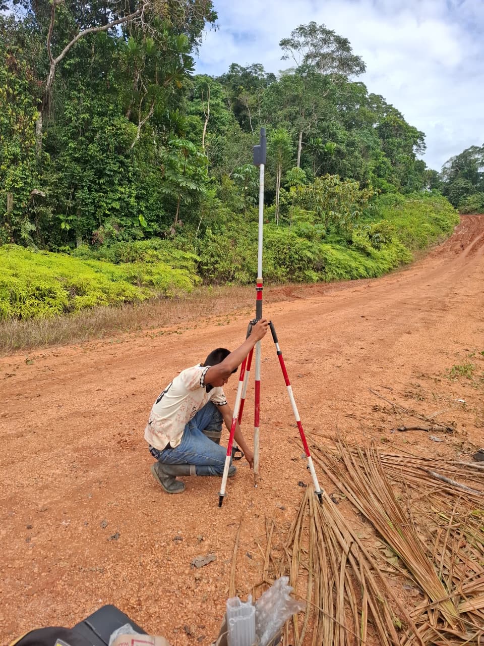 ROLAVI GNSS receiver on tripod along a forest road