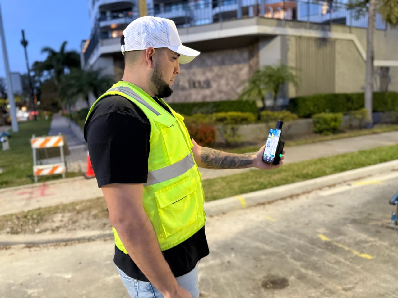 Surveyor using mobile GNSS workflow at night